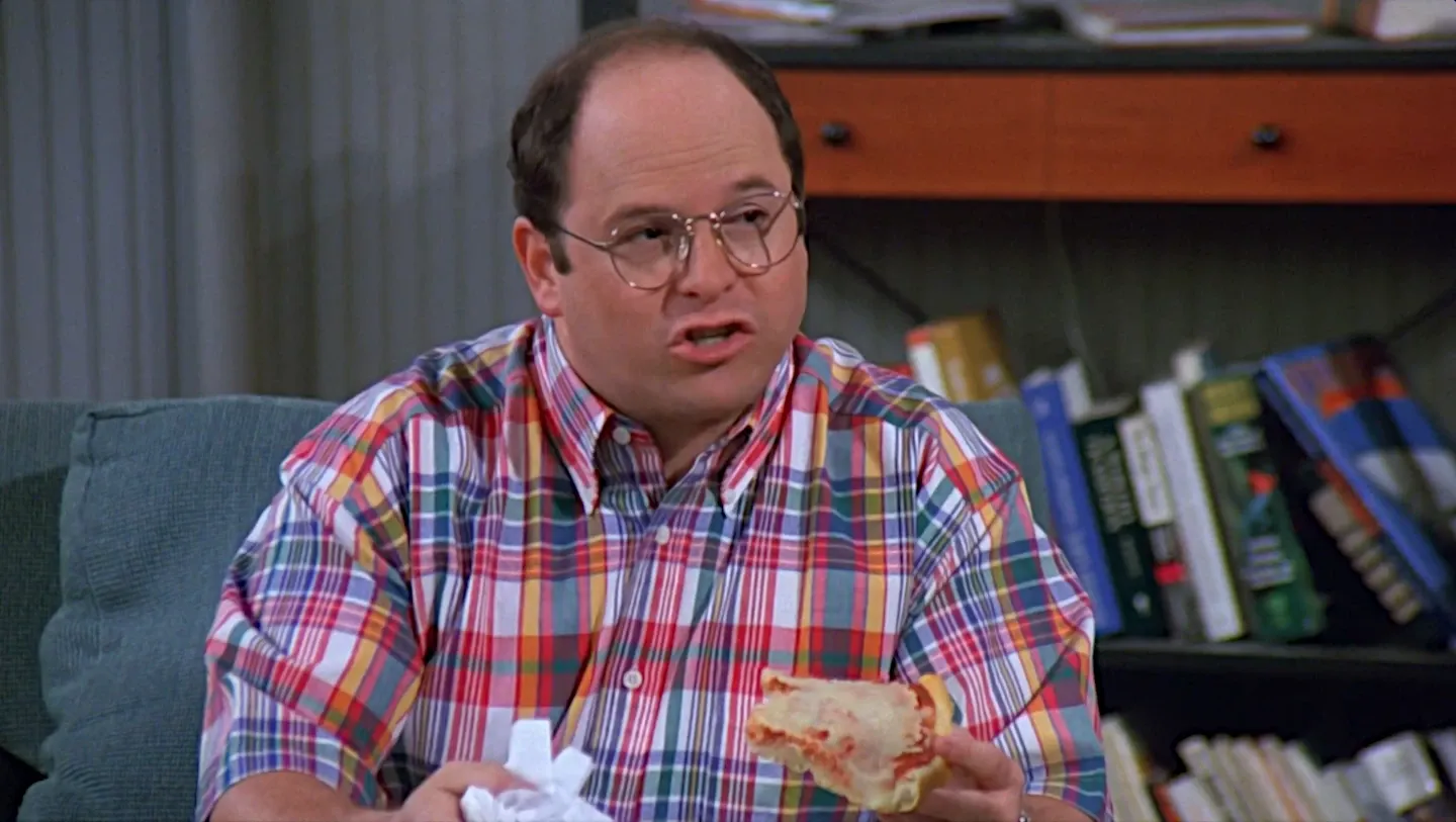 George eating pizza.