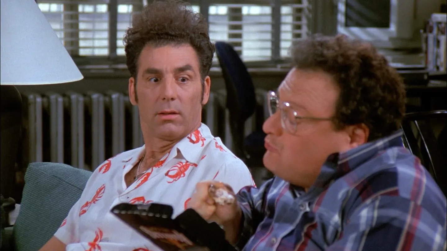 Kramer watching Newman eat chicken.