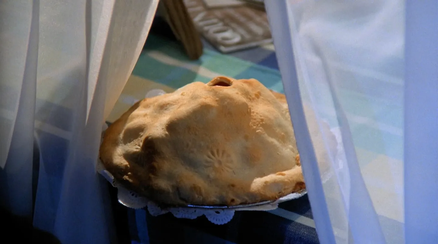 A pie sitting in an open window.